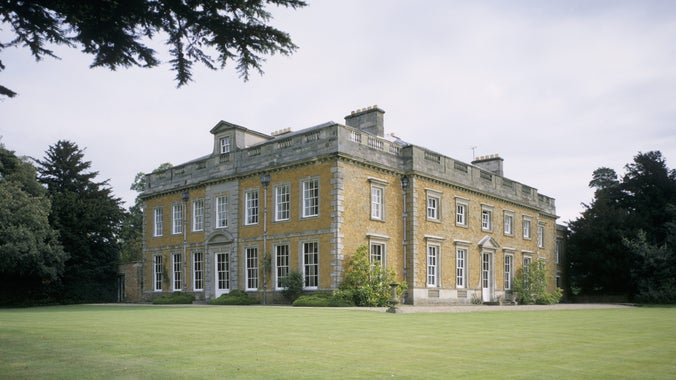 View of Farnborough Hall showing the south and west facades across the lawn